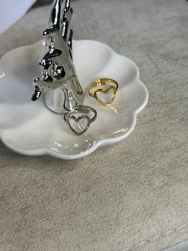Dúo Corazón — Pareja de corazones calados en oro y plata.