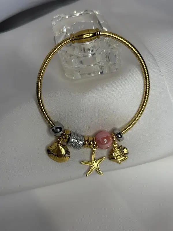 Charms del Mar — Brazalete de charms marinos.